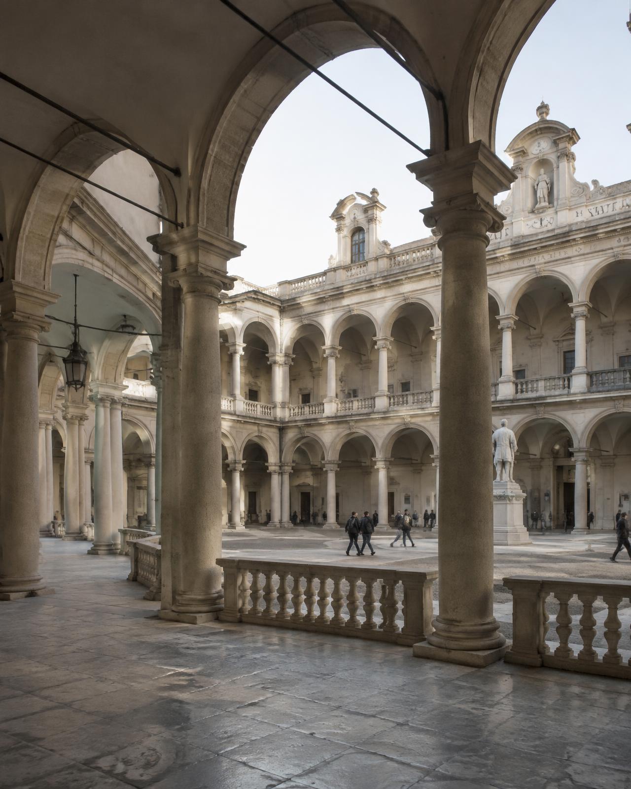Arcaded courtyard of a historic university with stone columns